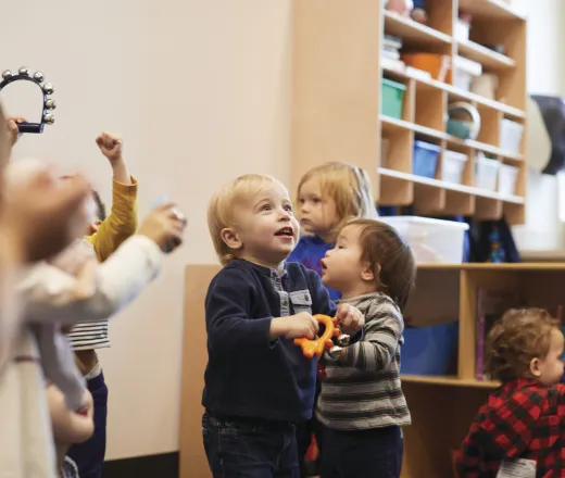 Toddlers playing at a childcare center.
