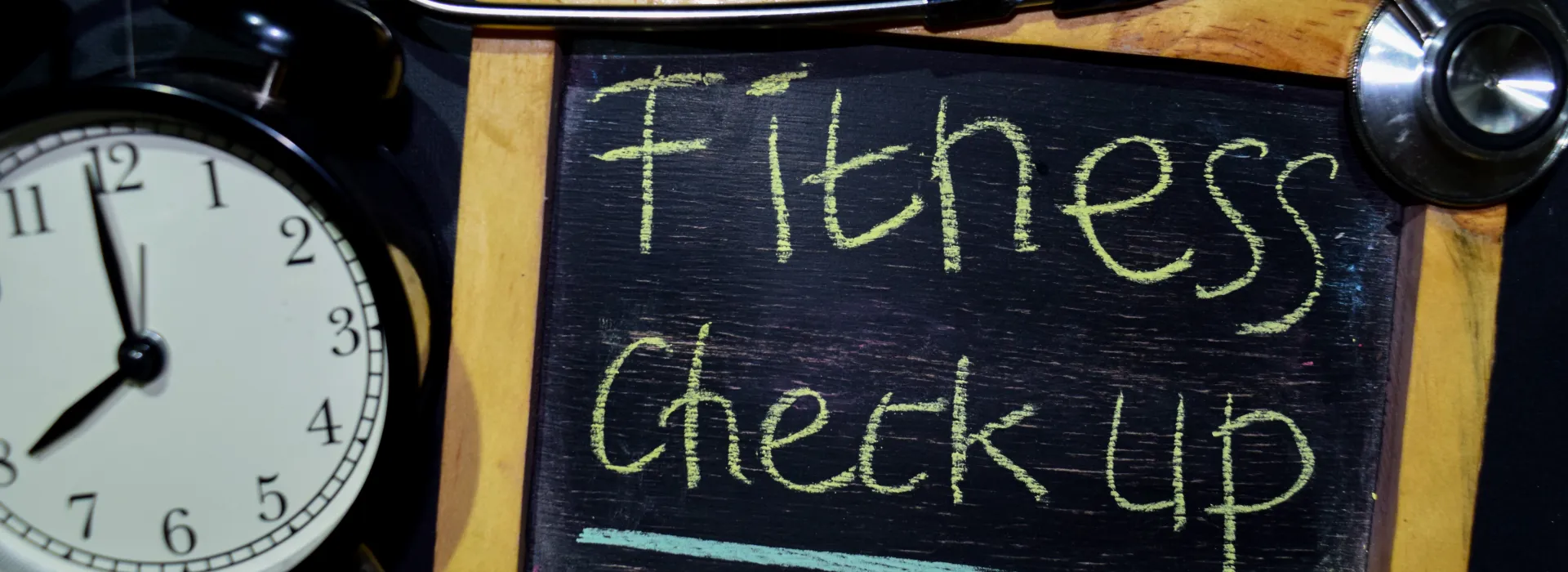 Picture of Fitness Check up written on chalkboard